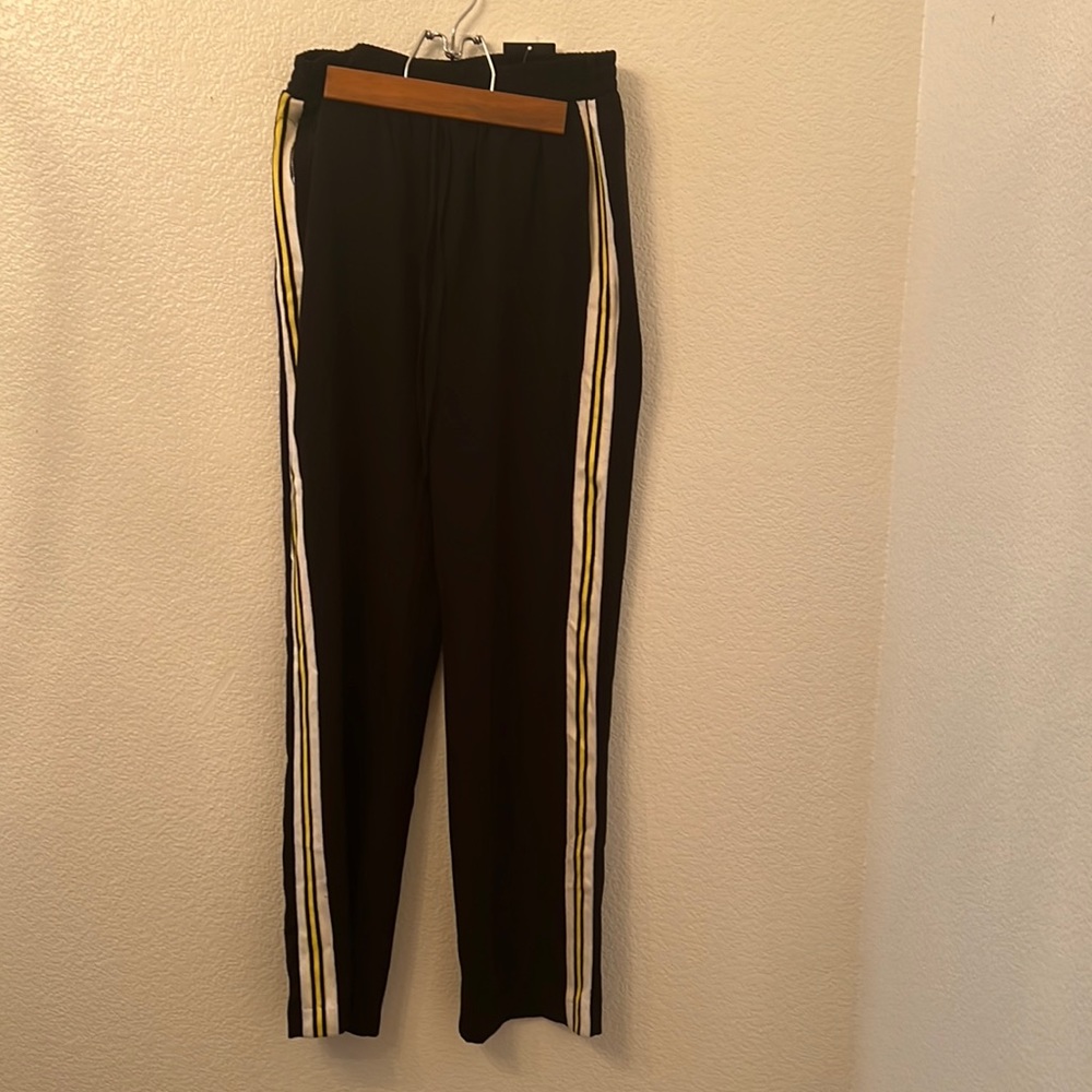 Black silk pants with white and yellow stripes